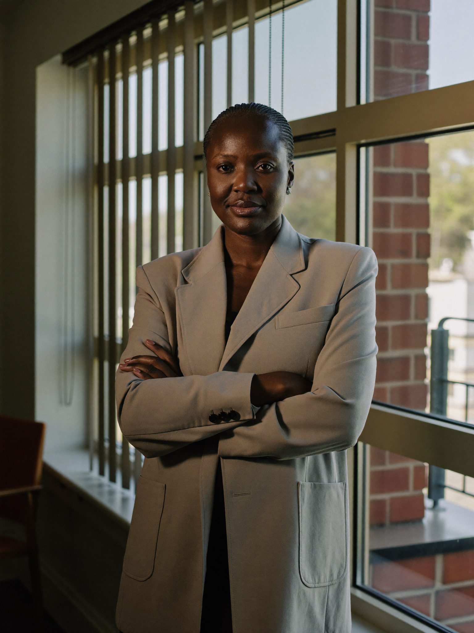 A Ciresta adviser beside a window in the Menlyn office